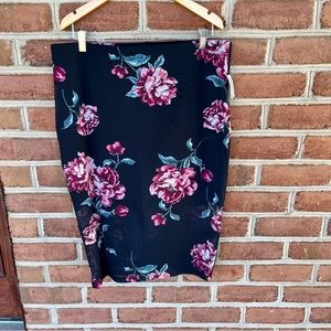 Fitted sexy spandex floral and black skirt. Size 2X.